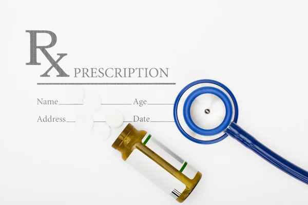 Medical prescription andl pills and stethoscope on table — Stock Photo, Image