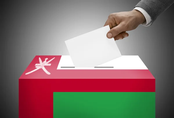 Ballot box painted into national flag colors - Oman — Stock Photo, Image