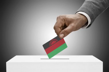 Siyah bayrak tutan erkek. Kavram - Malavi oylama