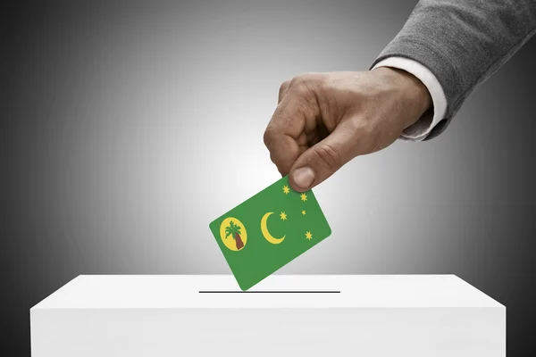 Black male holding flag. Voting concept - Cocos (Keeling) Islands — Stock Photo, Image