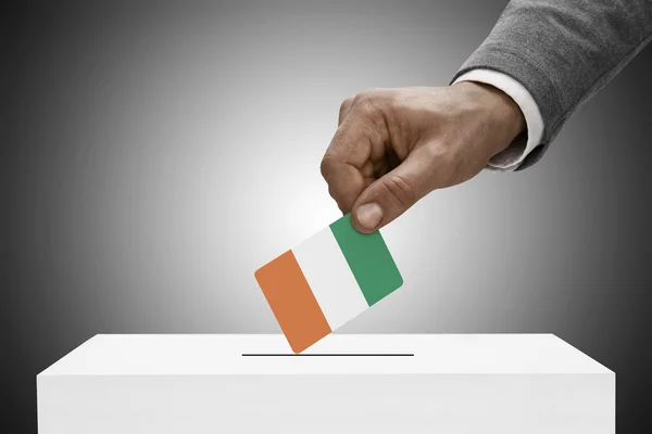 Black male holding flag. Voting concept - Republic of Cote d'Ivoire - Ivory Coast — Stock Photo, Image