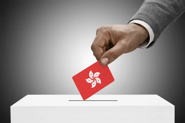 Black male holding flag. Voting concept - Hong Kong — Stock Photo, Image