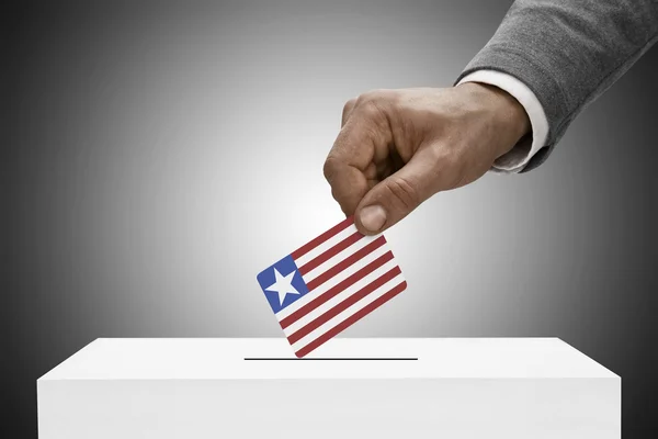 Black male holding flag. Voting concept - Liberia — Stock Photo, Image