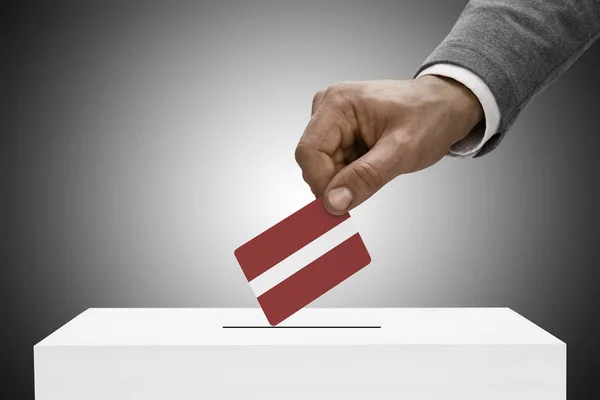 Black male holding flag. Voting concept - Latvia — Stock Photo, Image