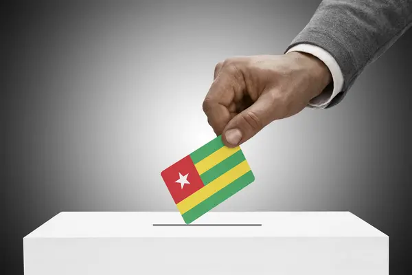 Black male holding flag. Voting concept - Togo — Stock Photo, Image