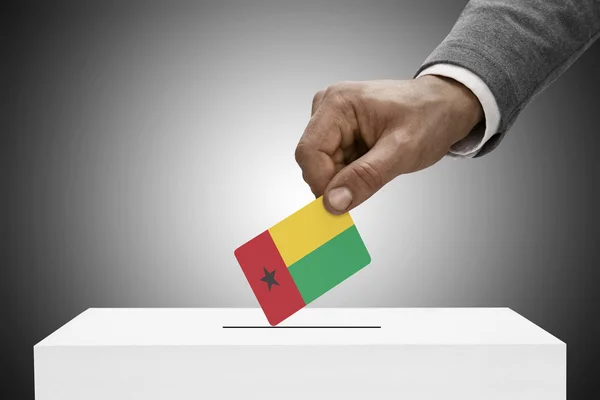 Black male holding flag. Voting concept - Guinea-Bissau — Stock Photo, Image