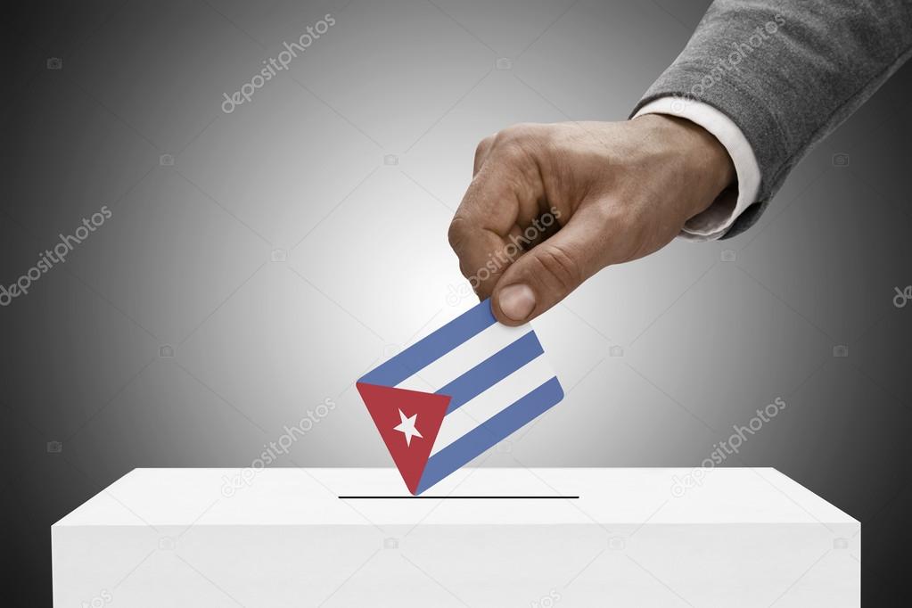Black male holding flag. Voting concept - Cuba