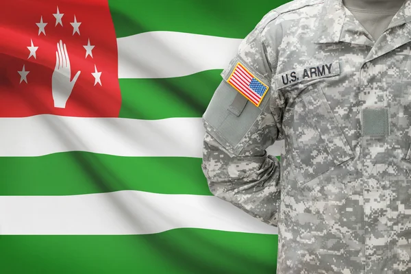 American soldier with flag on background - Abkhazia — Stock Photo, Image
