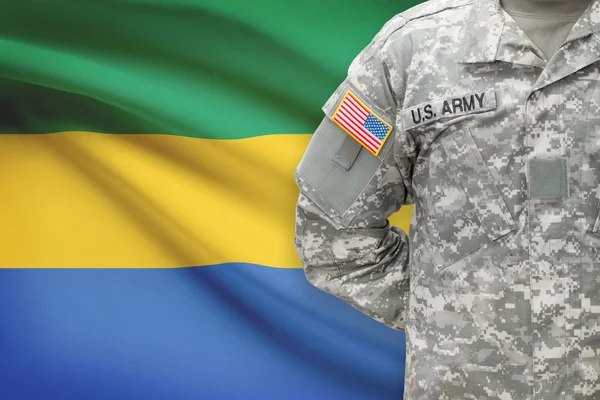 American soldier with flag on background - Gabon — Stok Foto
