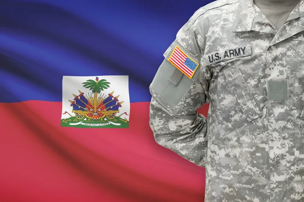 American soldier with flag on background - Haiti — Stock Photo, Image