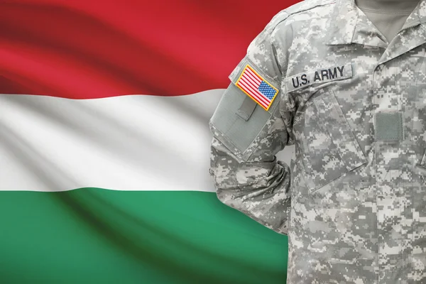 American soldier with flag on background - Hungary — Stock Photo, Image