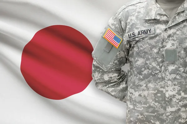 American soldier with flag on background - Japan — Stok Foto