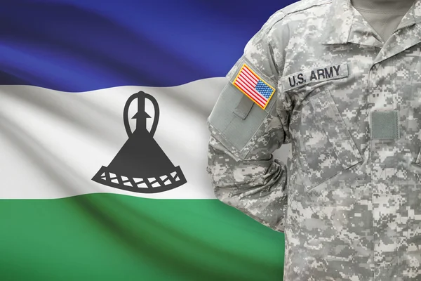 American soldier with flag on background - Lesotho — Stock Photo, Image