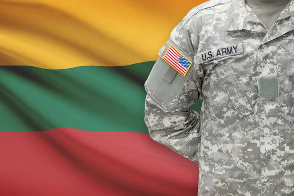 American soldier with flag on background - Lithuania — Stock Photo, Image