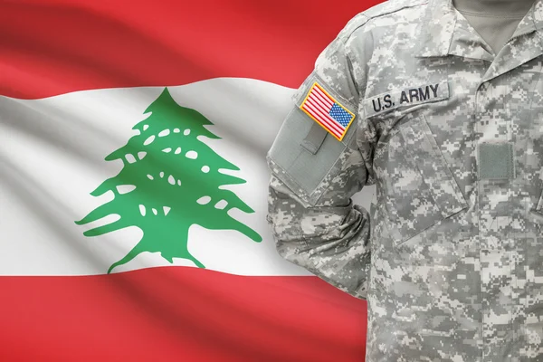 American soldier with flag on background - Lebanon - Stock-foto