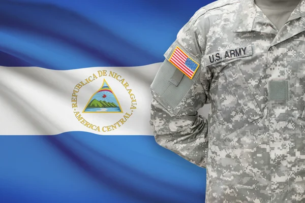 American soldier with flag on background - Nicaragua — Stok Foto