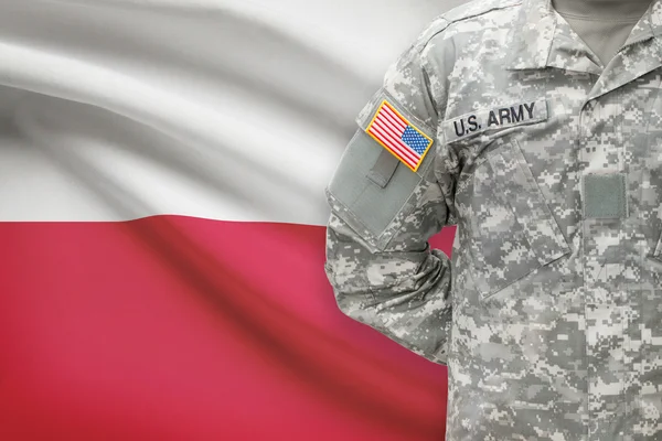 American soldier with flag on background - Poland — Stock Photo, Image