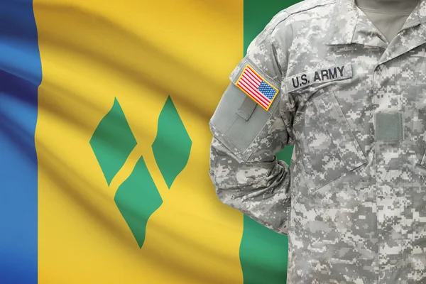 American soldier with flag on background - Saint Vincent and the Grenadines — Stock Photo, Image