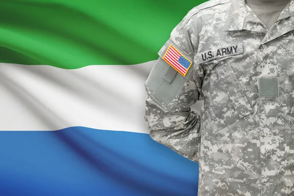 American soldier with flag on background - Sierra Leone — Stock Photo, Image