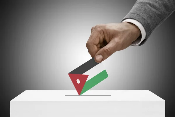 Maschio che tiene bandierina nero. Voto concetto - Jordan — Foto Stock