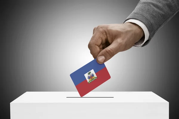 Black male holding flag. Voting concept - Haiti — Stok Foto