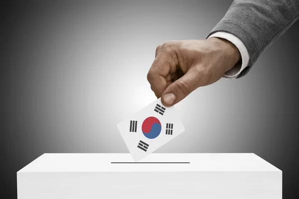 Black male holding flag. Voting concept - South Korea — Stock Photo, Image