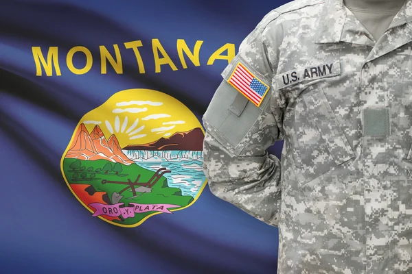 American soldier with US state flag on background - Montana — Stock Photo, Image