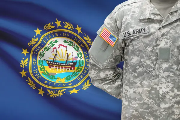 American soldier with US state flag on background - New Hampshire — Stock Photo, Image