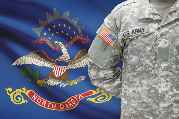 American soldier with US state flag on background - North Dakota — Stock Photo, Image