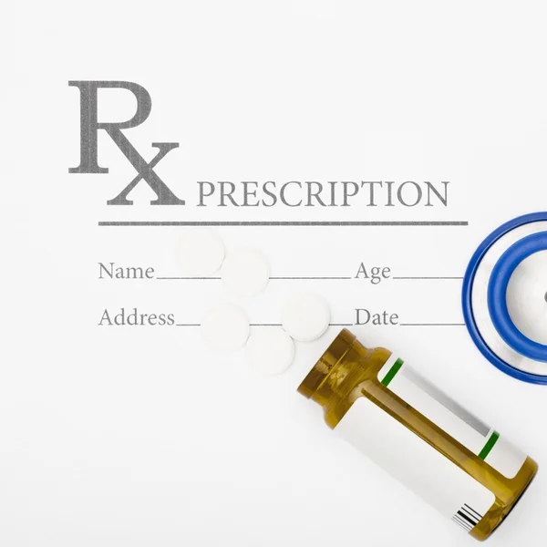 Medical prescription andl pills and stethoscope on table - studio shot — Stock Photo, Image