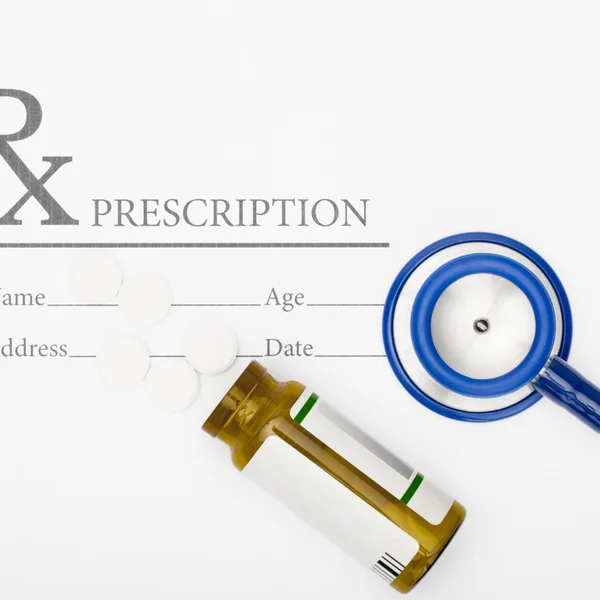 Medical prescription andl pills and stethoscope on table - studio shot — Stock Photo, Image