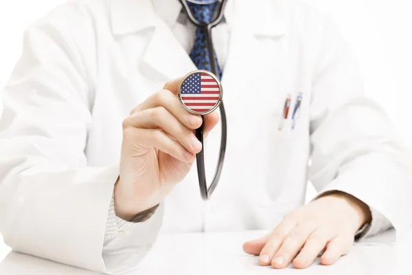 Doctor holding stethoscope with flag series - United States — Stock Photo, Image