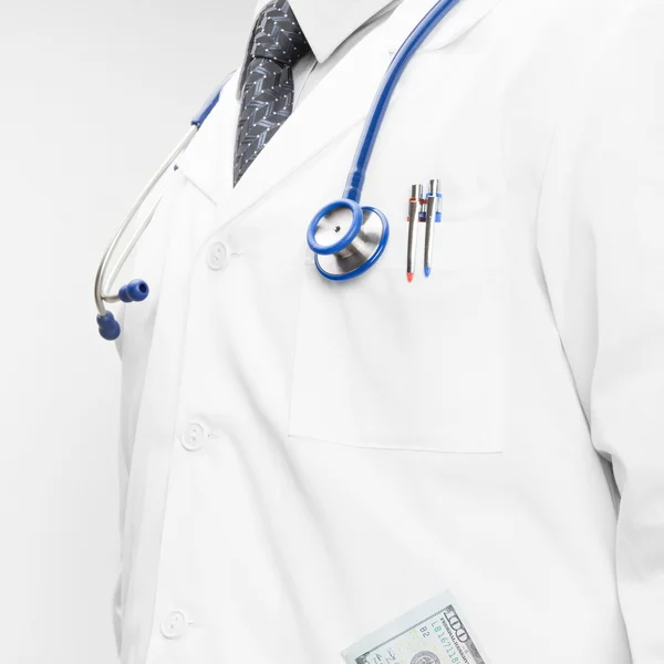 Doctor with money in his pocket — Stock Photo, Image