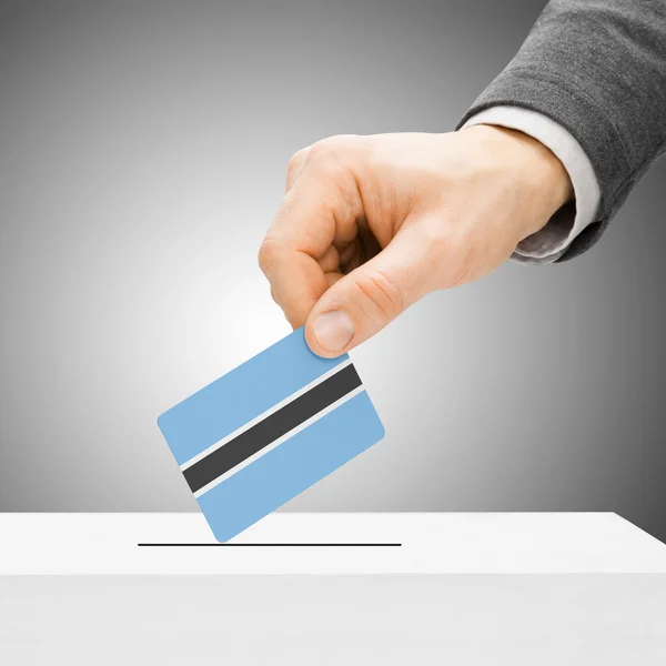 Voting concept - Male inserting flag into ballot box - Botswana — Stock Photo, Image