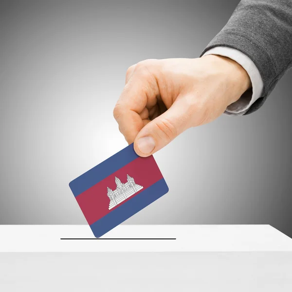 Voting concept - Male inserting flag into ballot box - Cambodia — Stock Photo, Image