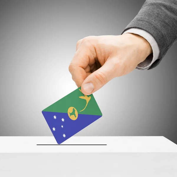 Voting concept - Male inserting flag into ballot box - Christmas — Stock Photo, Image