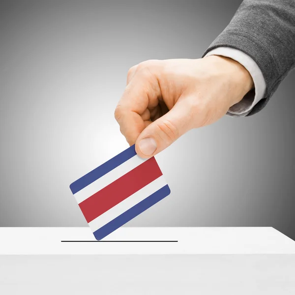 Voting concept - Male inserting flag into ballot box - Costa Ric — Stock Photo, Image