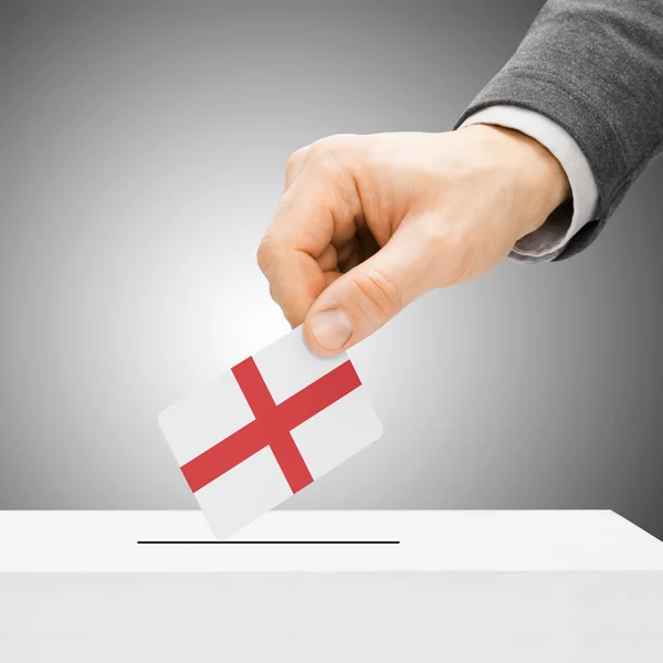 Voting concept - Male inserting flag into ballot box - England — Stock Photo, Image