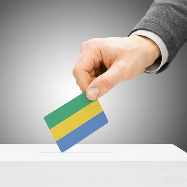 Voting concept - Male inserting flag into ballot box - Gabon — Stock Photo, Image