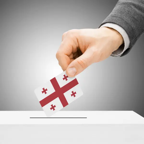 Voting concept - Male inserting flag into ballot box - Georgia — Stock Photo, Image