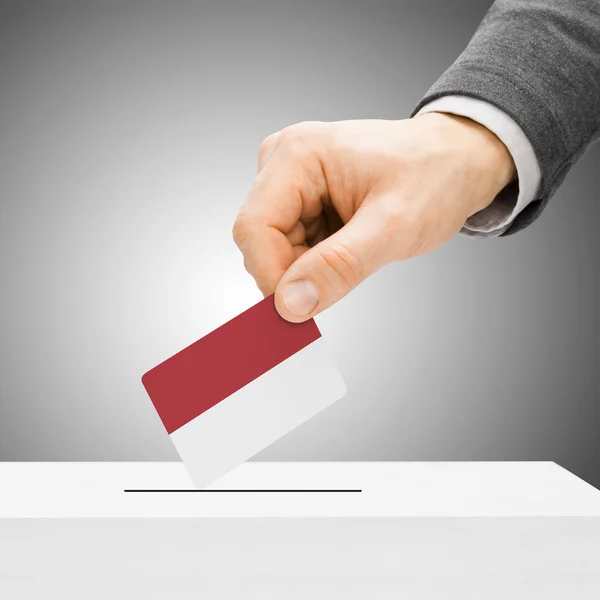 Voting concept - Male inserting flag into ballot box - Indonesia — Stock Photo, Image