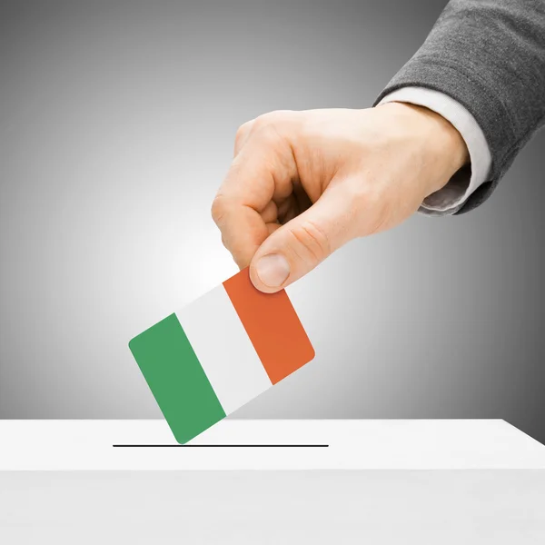 Voting concept - Male inserting flag into ballot box - Ireland — Stock Photo, Image