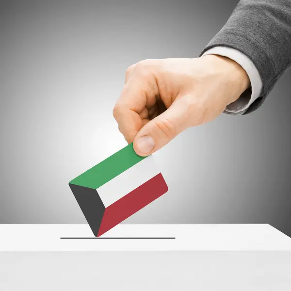 Voting concept - Male inserting flag into ballot box - Kuwait — Stock Photo, Image