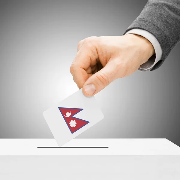 Voting concept - Male inserting flag into ballot box - Nepal — Stock Photo, Image