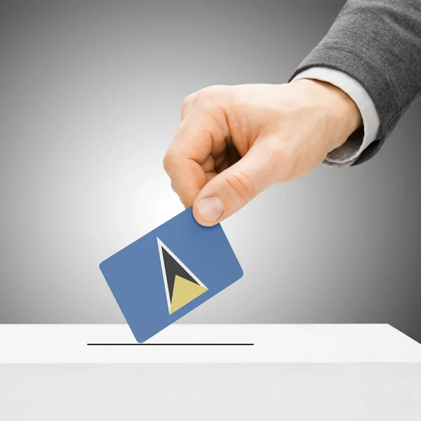 Voting concept - Male inserting flag into ballot box - Saint Luc — Stock Photo, Image