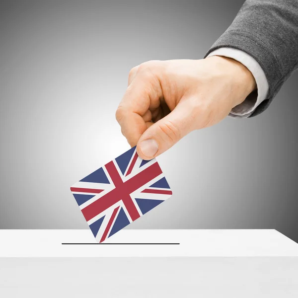 Voting concept - Male inserting flag into ballot box - United Ki — Stock Photo, Image