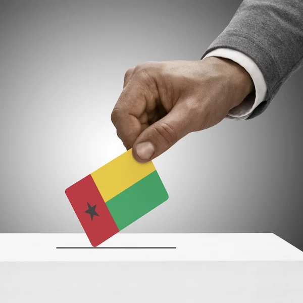 Black male holding flag. Voting concept - Guinea-Bissau — Stock Photo, Image