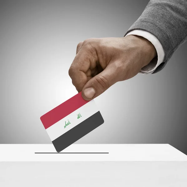 Black male holding flag. Voting concept - Iraq — Stock Photo, Image