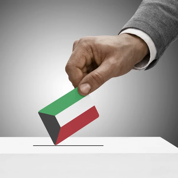 Black male holding flag. Voting concept - Kuwait — Stock Photo, Image