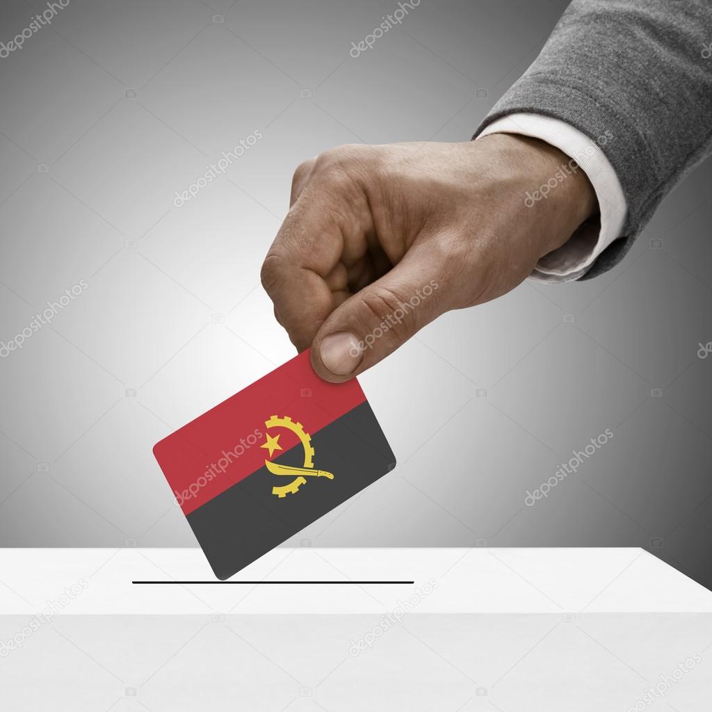 Black male holding flag. Voting concept - Angola